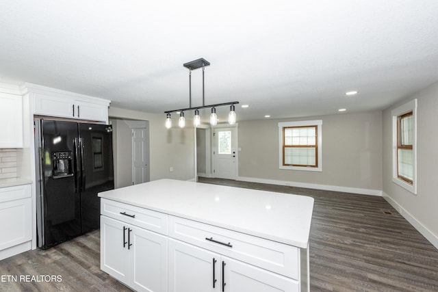 957 W Hunt Rd, Alcoa, TN 37701 - kitchen with black fridge with ice dispenser, dark wood-type flooring, white cabinets, hanging light fixtures, and recessed lighting