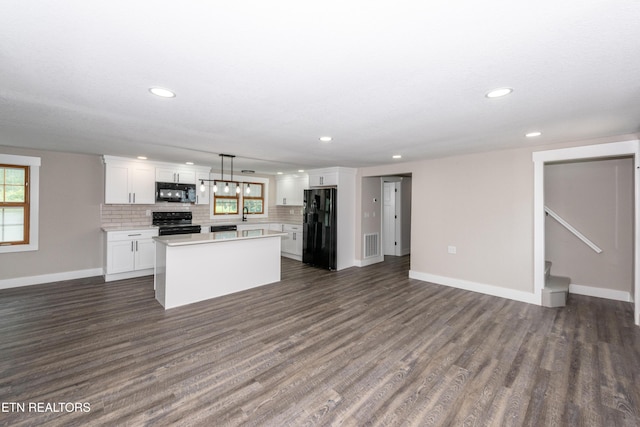 957 W Hunt Rd, Alcoa, TN 37701 - kitchen with black appliances, light countertops, white cabinets, a kitchen island, and dark wood finished floors