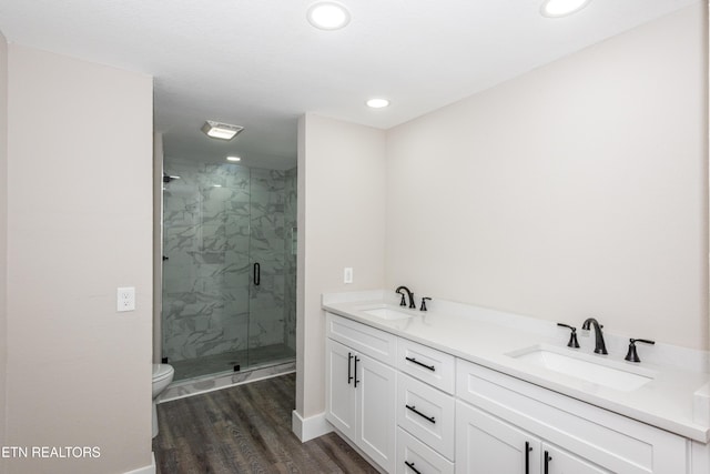 957 W Hunt Rd, Alcoa, TN 37701 - bathroom with a marble finish shower, wood finished floors, double vanity, and recessed lighting