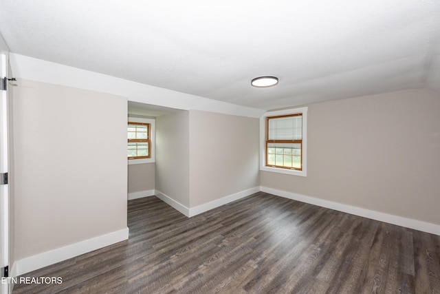 957 W Hunt Rd, Alcoa, TN 37701 - empty room with dark wood-style flooring and vaulted ceiling