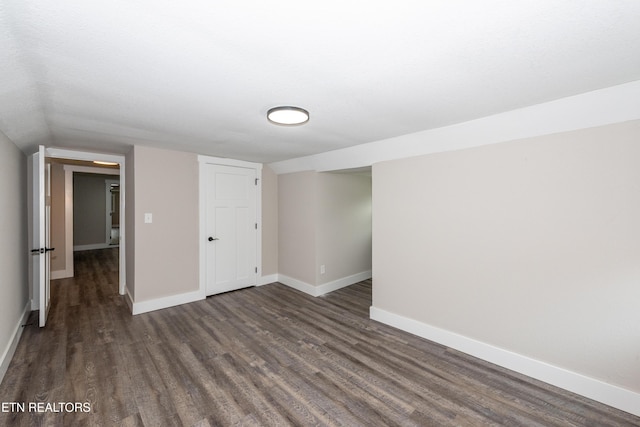 957 W Hunt Rd, Alcoa, TN 37701 - unfurnished bedroom featuring dark wood-style floors, a closet, and lofted ceiling