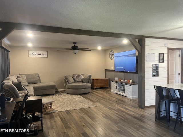 203 Baker Cir, Maynardville, TN 37807 - living area with a ceiling fan, dark wood-style floors, a textured ceiling, and wood walls
