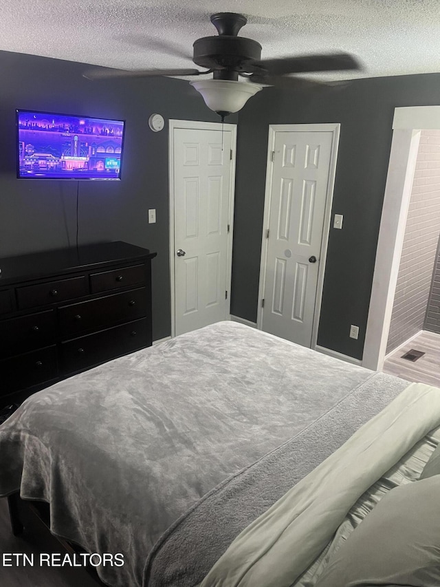 203 Baker Cir, Maynardville, TN 37807 - bedroom with a textured ceiling and a ceiling fan