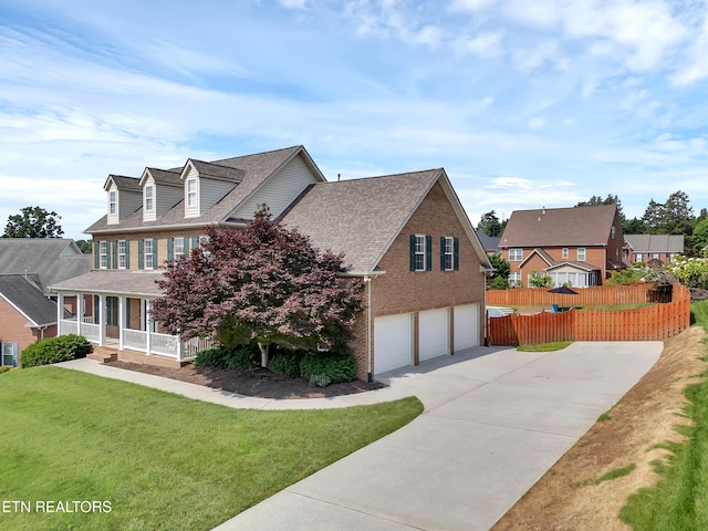 1511 Atlee Summit Ln, Knoxville, TN 37931 - view of home's exterior featuring an attached garage, a porch, driveway, roof with shingles, and brick siding