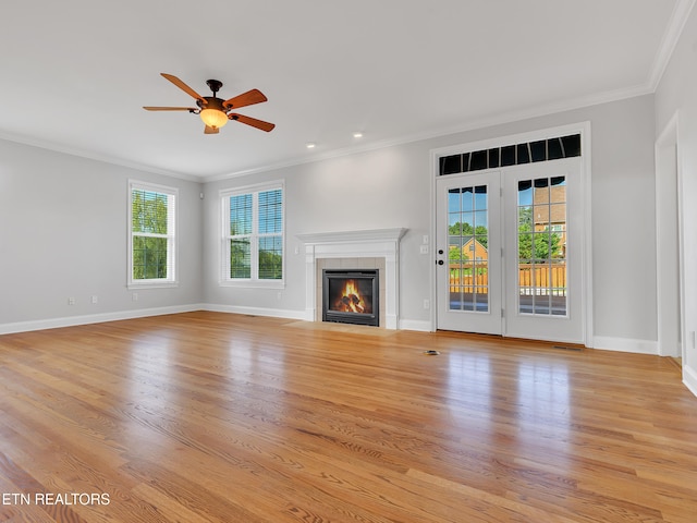 1511 Atlee Summit Ln, Knoxville, TN 37931 - unfurnished living room featuring crown molding, ceiling fan, a tiled fireplace, light wood-type flooring, and recessed lighting
