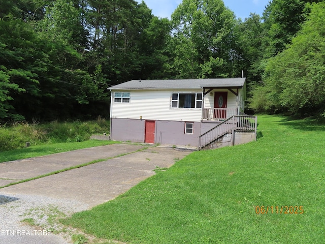 110 Dale Rd, Oakdale, TN 37829 - view of front of house featuring a front lawn, a wooded view, and stairway