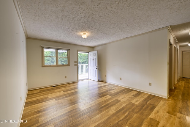 609 Lane Hollow Rd, Sevierville, TN 37876 - spare room featuring a textured ceiling, light wood-type flooring, and crown molding