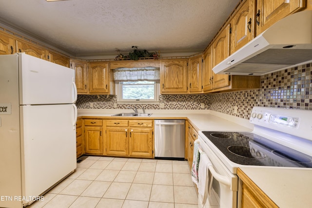 609 Lane Hollow Rd, Sevierville, TN 37876 - kitchen with white appliances, under cabinet range hood, light countertops, brown cabinetry, and light tile patterned floors