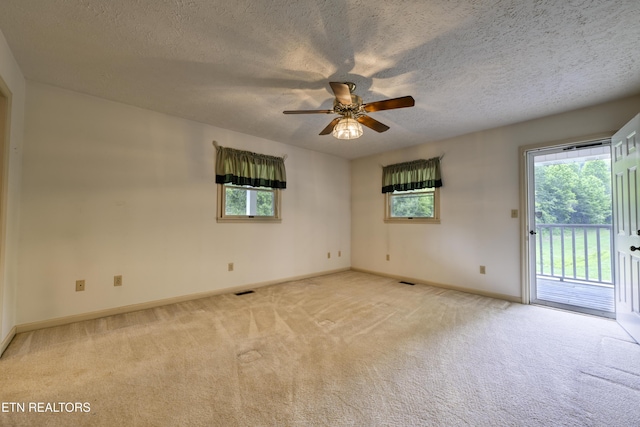 609 Lane Hollow Rd, Sevierville, TN 37876 - empty room with light colored carpet, a ceiling fan, and a textured ceiling