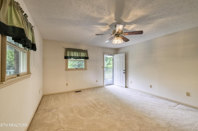 609 Lane Hollow Rd, Sevierville, TN 37876 - spare room featuring a textured ceiling, light carpet, and ceiling fan