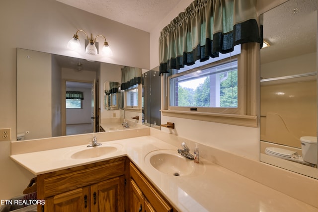 609 Lane Hollow Rd, Sevierville, TN 37876 - bathroom featuring a textured ceiling, vanity, and a shower