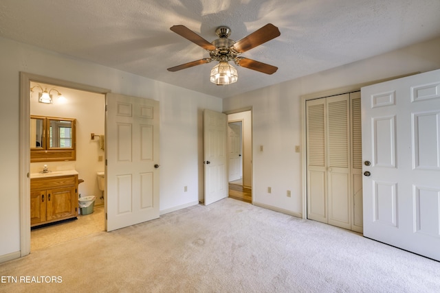 609 Lane Hollow Rd, Sevierville, TN 37876 - unfurnished bedroom with light colored carpet, a closet, ensuite bath, ceiling fan, and a textured ceiling