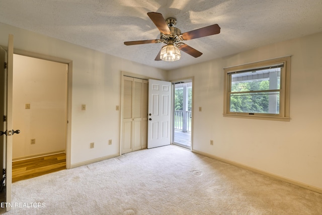 609 Lane Hollow Rd, Sevierville, TN 37876 - unfurnished bedroom with carpet floors, access to exterior, a textured ceiling, and a ceiling fan