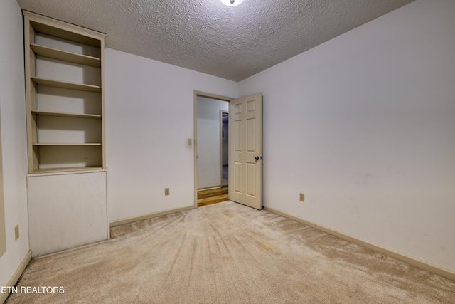 609 Lane Hollow Rd, Sevierville, TN 37876 - spare room with carpet flooring and a textured ceiling