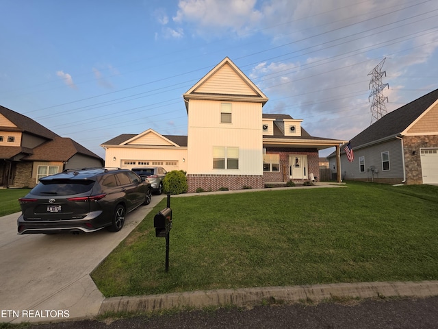 6312 Knightsboro Rd, Knoxville, TN 37912 - view of front of home with concrete driveway, a front yard, a garage, and brick siding