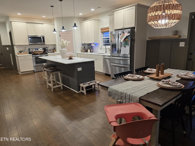 6312 Knightsboro Rd, Knoxville, TN 37912 - kitchen with stainless steel appliances, dark wood finished floors, backsplash, light countertops, and recessed lighting