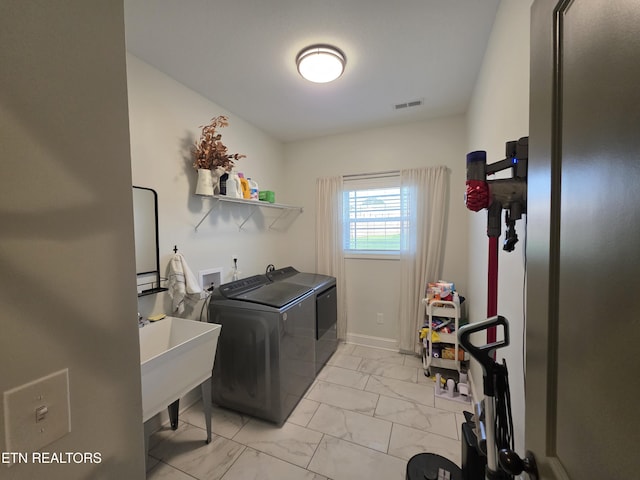 6312 Knightsboro Rd, Knoxville, TN 37912 - washroom with washing machine and clothes dryer and light marble finish flooring