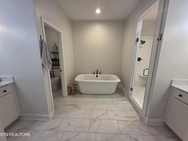 6312 Knightsboro Rd, Knoxville, TN 37912 - bathroom featuring marble look tiles, vanity, a soaking tub, a stall shower, and recessed lighting