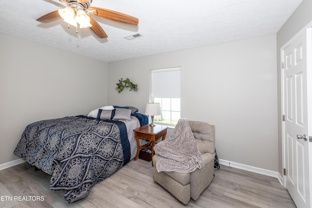 2544 Bay Meadows Way, Sevierville, TN 37876 - bedroom with wood finished floors, ceiling fan, and a textured ceiling