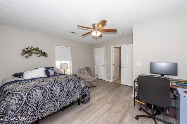 2544 Bay Meadows Way, Sevierville, TN 37876 - bedroom featuring wood finished floors, an office area, ceiling fan, and a textured ceiling
