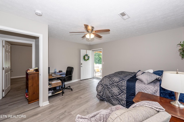 2544 Bay Meadows Way, Sevierville, TN 37876 - bedroom with light wood-style flooring, access to outside, a desk, a ceiling fan, and a textured ceiling