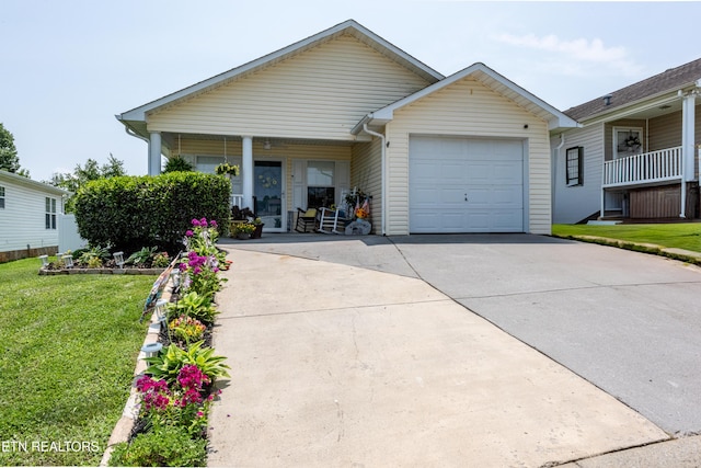 2544 Bay Meadows Way, Sevierville, TN 37876 - view of front of house with a garage, driveway, a front yard, and covered porch