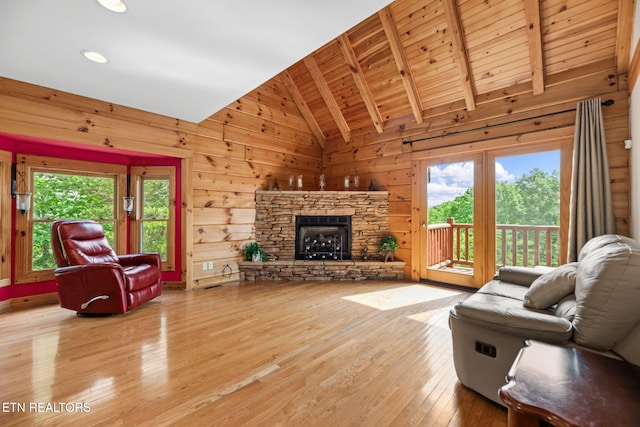 152 Eagle Crst, Tazewell, TN 37879 - living area with plenty of natural light, light wood finished floors, a fireplace, wooden walls, and recessed lighting