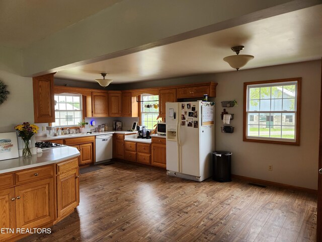 1865 Campground Rd, Clarkrange, TN 38553 - kitchen featuring white appliances, light countertops, dark wood-style floors, and brown cabinetry