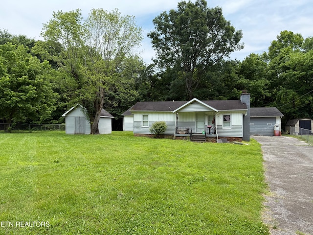 6032 Atkins Rd, Knoxville, TN 37918 - ranch-style home with a chimney, a shed, roof with shingles, and a garage