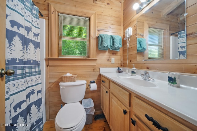 3319 Covered Bridge Way, Sevierville, TN 37862 - full bath featuring vanity, wood walls, curtained shower, and wood finished floors