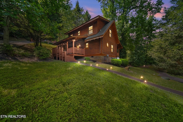3319 Covered Bridge Way, Sevierville, TN 37862 - view of front of property with log siding, crawl space, and a yard