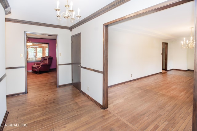 146 Lake Hills Dr, Oak Ridge, TN 37830 - unfurnished room with a chandelier, wood finished floors, and crown molding