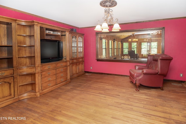 146 Lake Hills Dr, Oak Ridge, TN 37830 - living area with a chandelier, light wood-style flooring, and crown molding
