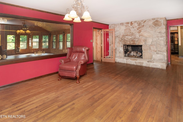 146 Lake Hills Dr, Oak Ridge, TN 37830 - living room featuring a chandelier, hardwood / wood-style floors, and a stone fireplace