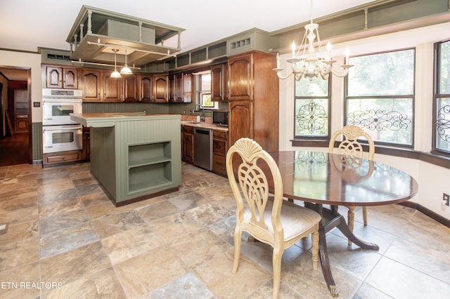 146 Lake Hills Dr, Oak Ridge, TN 37830 - dining area featuring a chandelier, light stone finish floors, and ornamental molding