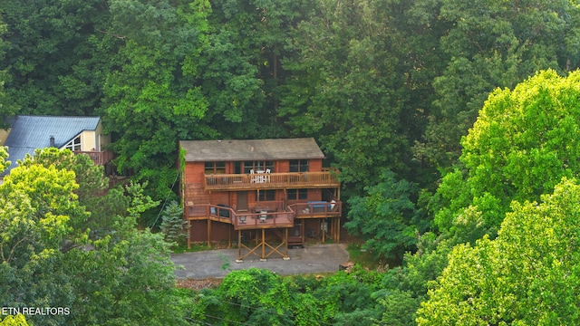 1516 Zurich Rd, Gatlinburg, TN 37738 - back of property featuring a patio area, a wooden deck, and a view of trees