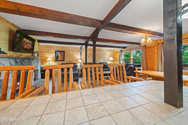 1516 Zurich Rd, Gatlinburg, TN 37738 - dining area with wooden walls, beam ceiling, a chandelier, a textured ceiling, and tile patterned floors