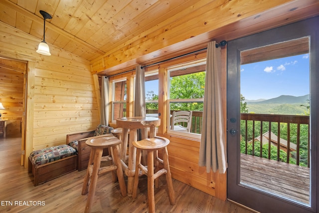 1516 Zurich Rd, Gatlinburg, TN 37738 - dining room featuring a mountain view, wood finished floors, wood walls, and wooden ceiling