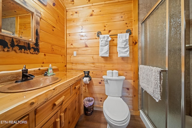 1516 Zurich Rd, Gatlinburg, TN 37738 - bathroom featuring vanity, a stall shower, wood walls, and wood finished floors