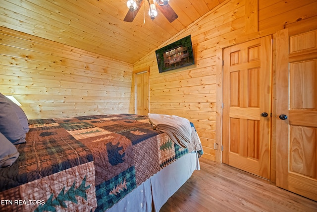 1516 Zurich Rd, Gatlinburg, TN 37738 - bedroom with vaulted ceiling, wooden walls, light wood finished floors, wooden ceiling, and ceiling fan