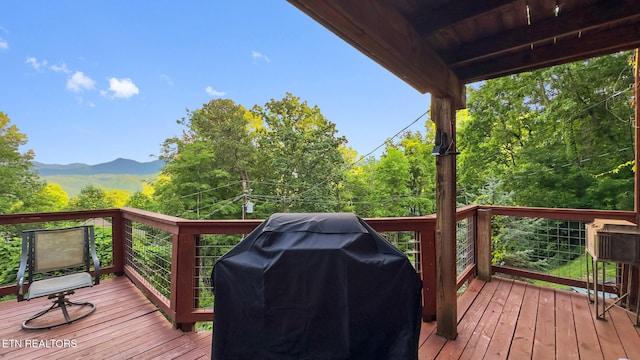 1516 Zurich Rd, Gatlinburg, TN 37738 - wooden deck with area for grilling and a mountain view