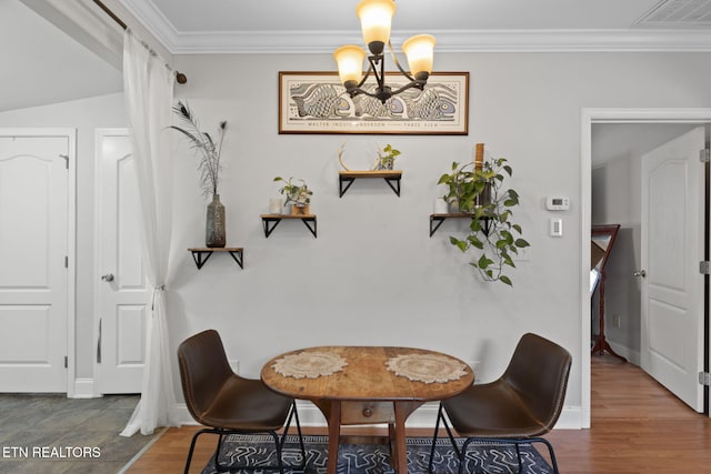 1132 Connecticut Ave, Knoxville, TN 37921 - dining space featuring a chandelier, ornamental molding, and wood finished floors
