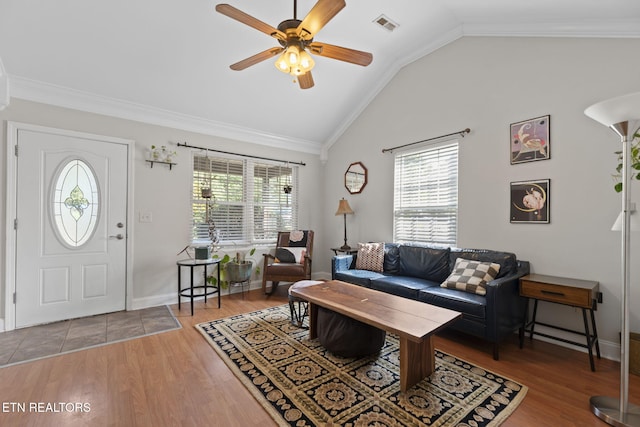 1132 Connecticut Ave, Knoxville, TN 37921 - living room with healthy amount of natural light, vaulted ceiling, ceiling fan, wood finished floors, and ornamental molding