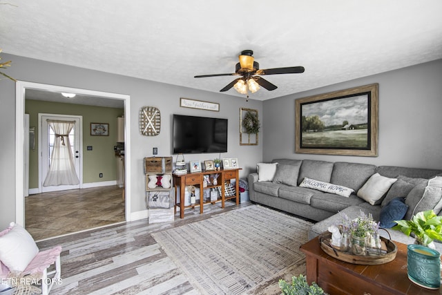 155 Kay Springs Cir, Jacksboro, TN 37757 - living room featuring a ceiling fan, a textured ceiling, and wood finished floors