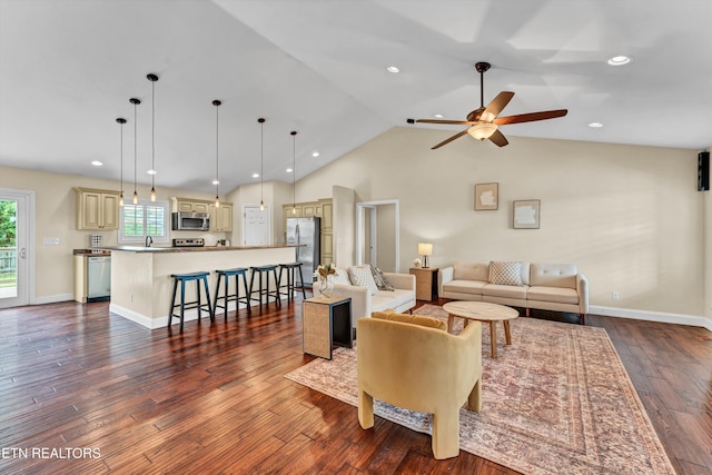 235 Jessie Ln, Lenoir City, TN 37772 - living room with a ceiling fan, dark wood finished floors, vaulted ceiling, and recessed lighting