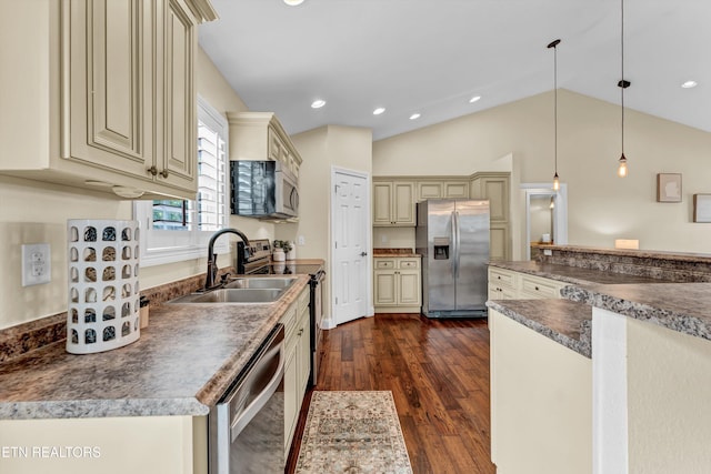 235 Jessie Ln, Lenoir City, TN 37772 - kitchen featuring cream cabinetry, stainless steel appliances, dark countertops, dark wood-type flooring, and lofted ceiling