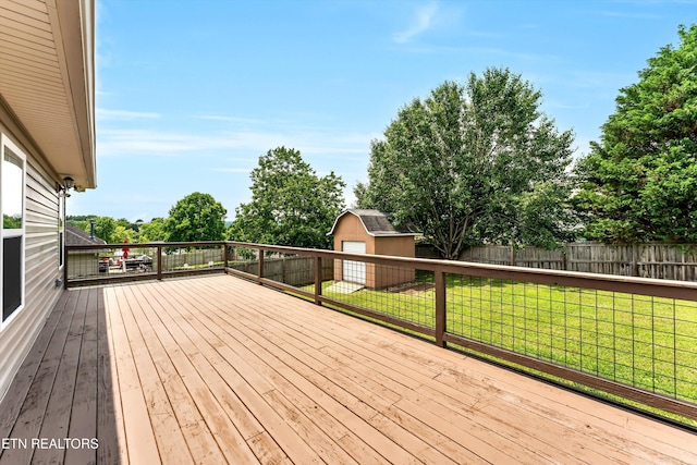 235 Jessie Ln, Lenoir City, TN 37772 - wooden terrace featuring a fenced backyard and a storage unit