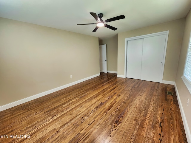 212 Ellison Rd, Lafollette, TN 37766 - unfurnished bedroom with a closet, wood finished floors, and ceiling fan