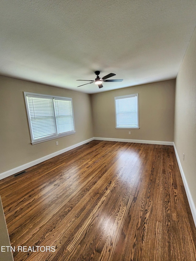 212 Ellison Rd, Lafollette, TN 37766 - spare room featuring ceiling fan and dark wood-type flooring