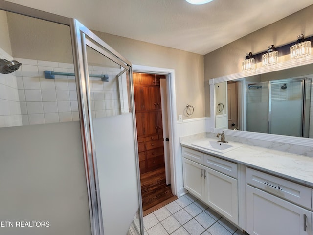 212 Ellison Rd, Lafollette, TN 37766 - full bathroom with a stall shower, tile patterned flooring, and vanity
